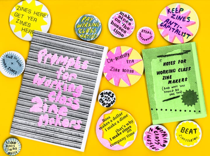 a bunch of zines and badges laid out. (image repeats further down with more detailed alt text)